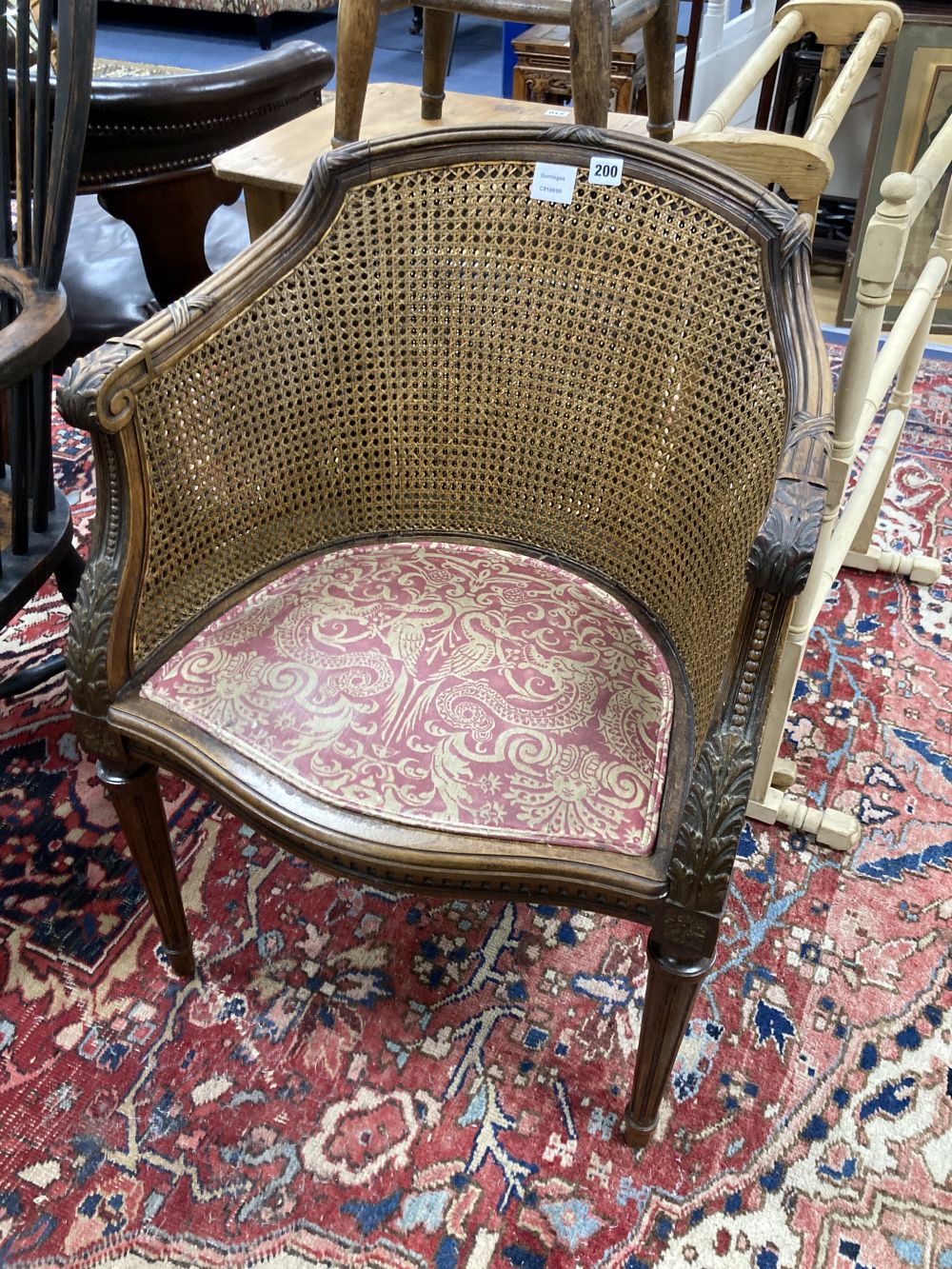 A caned tub chair